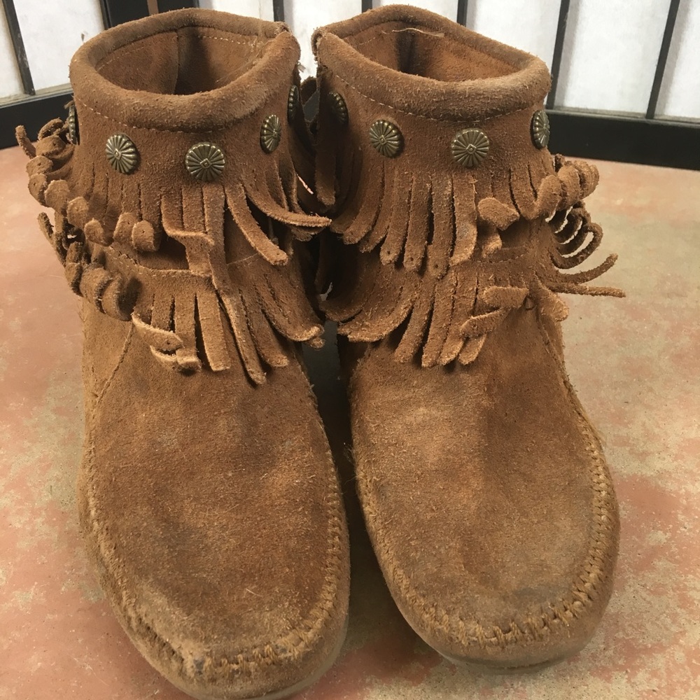 Minnetonka ankle bootie with studs and tassels